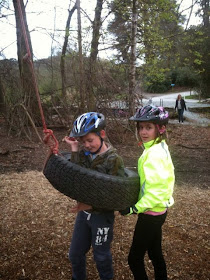 helpful big sister with the tyre swing
