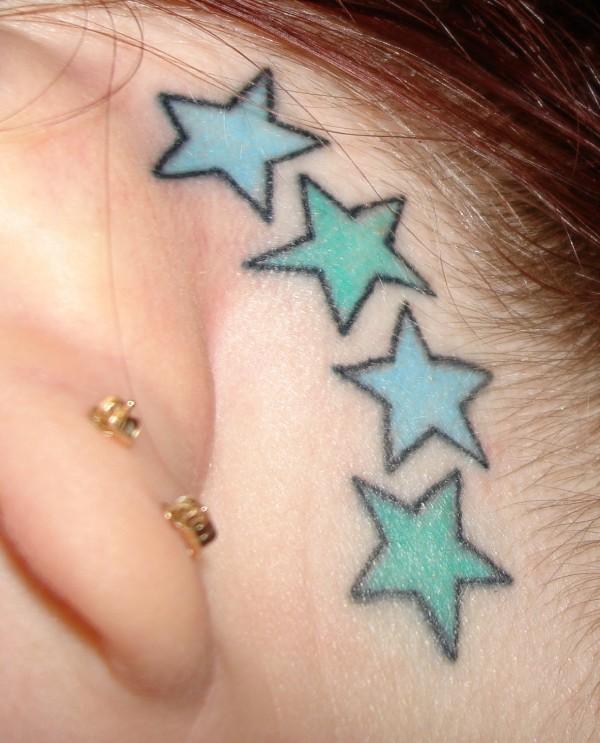 Look Star and heart tattoos behind the ear 