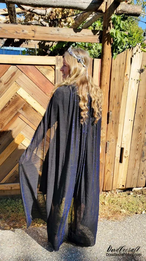The sunlight makes that shimmer so bright. It's sheer fabric, which is a great look for the cape too!