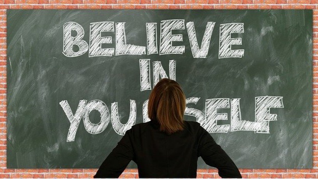 Believe in yourself written on a board