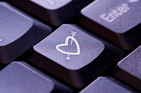 picture of a keyboard and on the key next to enter is a heart with an arrow through it