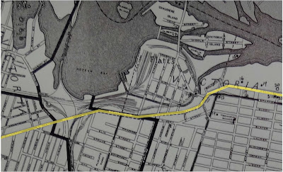 1940 Map of Ottawa, closeup of LeBreton Flats neighbourhood with Wellington Street highlighted across it with a yellow line.