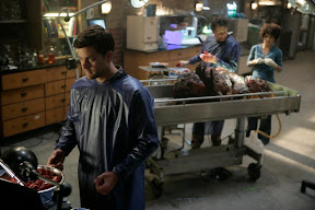 FRINGE: Peter (Joshua Jackson, L) works with Walter (John Noble, C) and Astrid (Jasika Nicole, R) to examine evidence in the FRINGE episode The Transformation