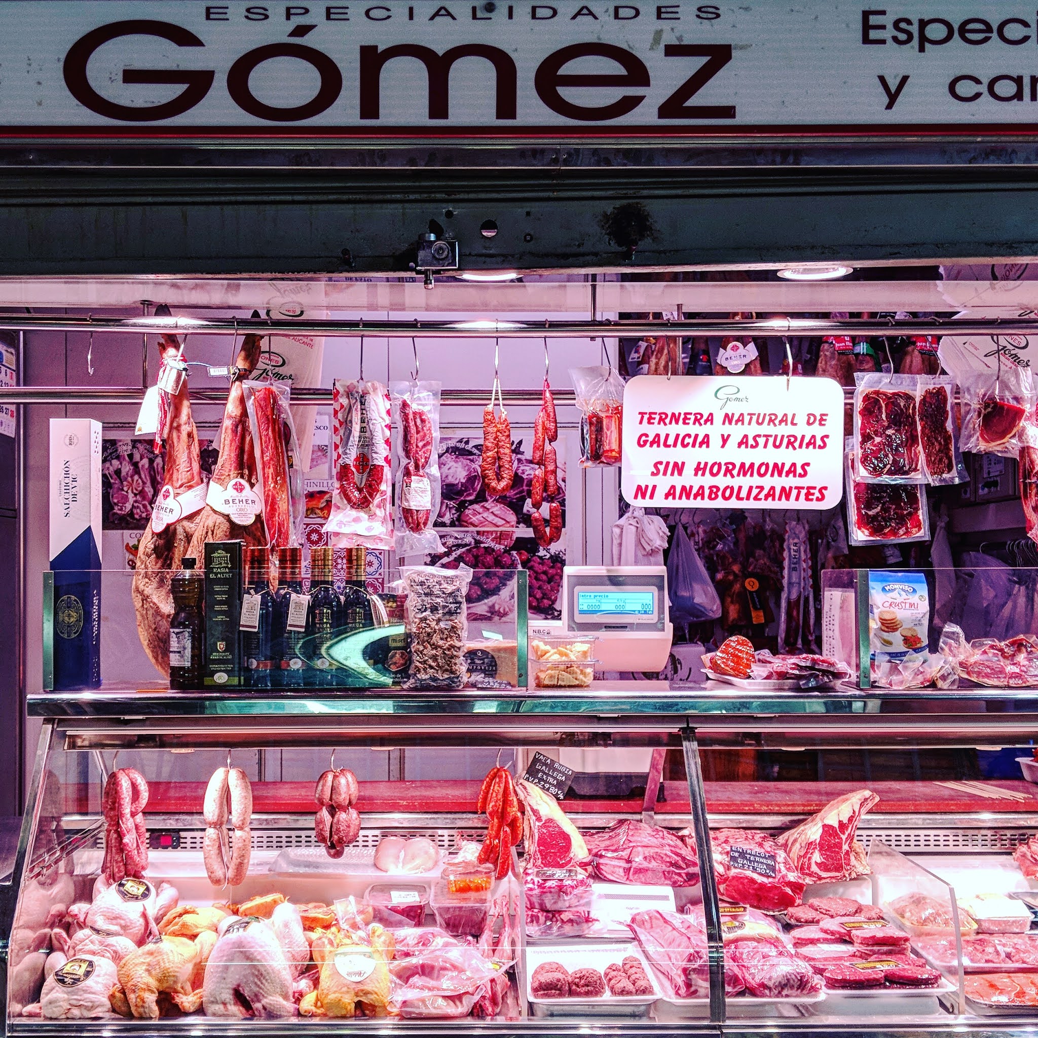 counter full of meat at the central market in alicante