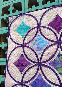 Moonrise quilt by Slice of Pi Quilts using Lavendula fabrics by Island Batik