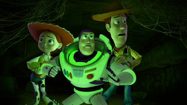 Jessie, Buzz, and Woody hear something in the dark in "Toy Story of Terror!"