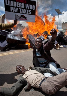 Protesters enjoy after establishing flame to concept coffins on which were published "State Funeral, Poll Revolution" outside the Parliament in Nairobi, South africa Wed, Jan. 16, 2013. Thousands of demonstrators angered at confident Kenyan law makers, whose phrase finished previously this weeks time and who generate about $175,000 a season in a nation where the normal yearly earnings is $1,700, doused 221 concept coffins with fuel, one for each legislator, to demonstration against last week's make an effort to prize themselves a $110,000 reward, which was vetoed by the chief executive.