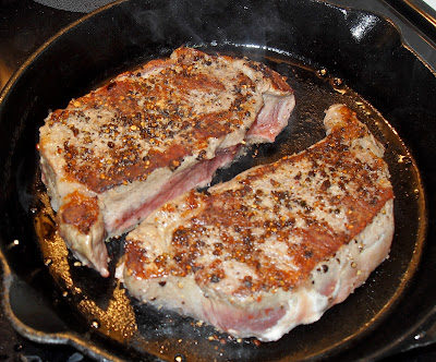 pepper crusted steak in cast iron skillet