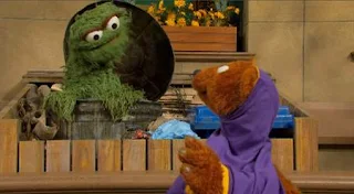 Baby Bear sets up today's theme of getting dressed while he struggles doing it himself. Oscar points out his head is in the sleeve. Sesame Street Episode 5004, Get Dressed Not Stressed, Season 50