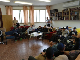 Secular high school students spending a day learning at the Bet El Yeshiva