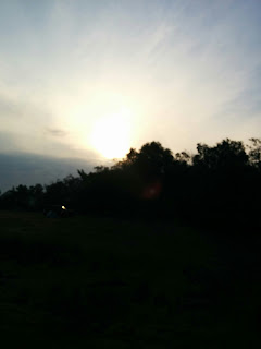 The Sun Rising Above The Trees at our Camping Site