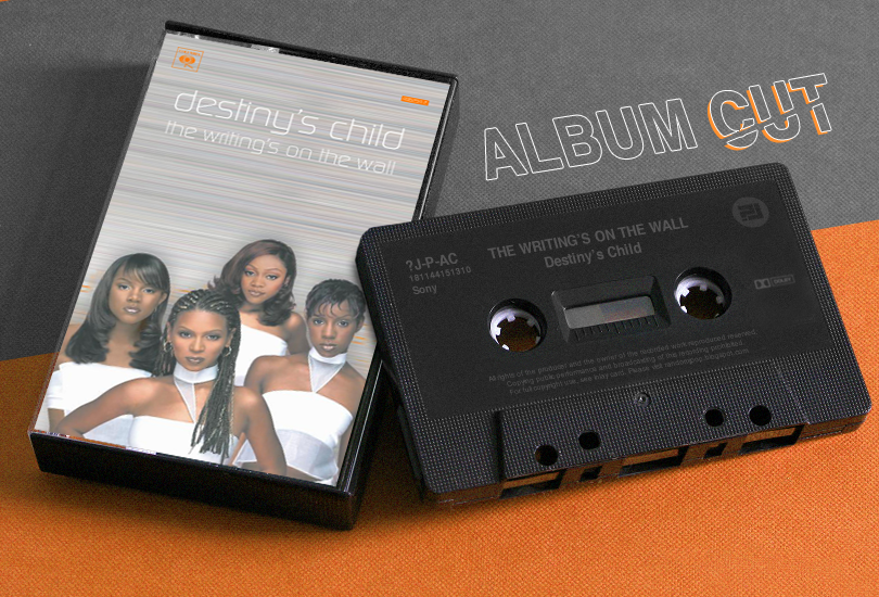 A cassette tape of Destiny’s Child’s second studio album ‘The Writing’s on the Wall’ lying on a surface, with the words ‘ALBUM CUTS’ superimposed onto the image on the top right-hand side.