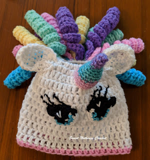 Sweet Nothings Crochet free crochet pattern blog, free crochet pattern for a unicorn soap dispenser bottle cover, this blog has video tutorials, photo of unicorn soap dispenser bottle cover,