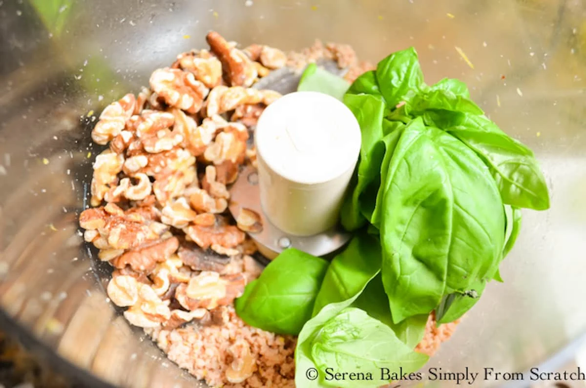 Walnuts and Fresh Basil added to food processor for Walnut Pesto.