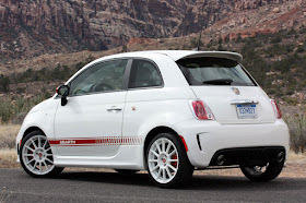 2012 Fiat 500 Abarth rear 3/4 view parked with mountains in background