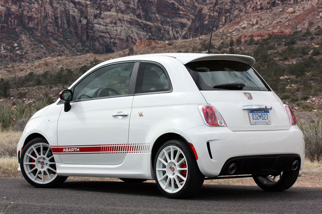 2012 Fiat 500 Abarth rear 3/4 view parked with mountains in background