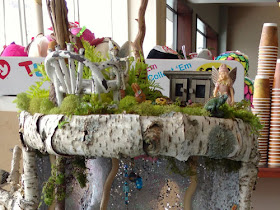 fairy house made of birch bark and moss