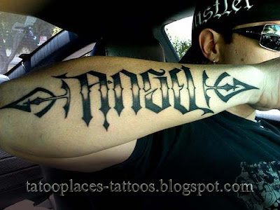 lettering tattoo on back. other tattoo lettering.