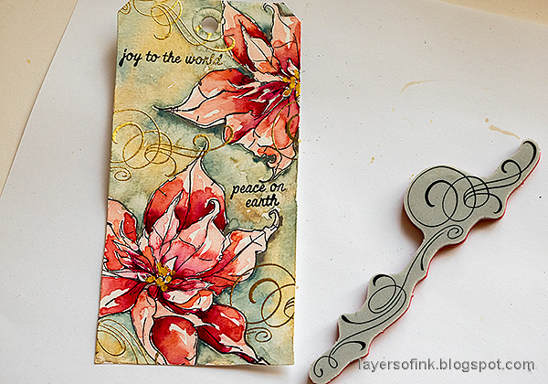 Layers of ink - Poinsettia Watercolor Tag Tutorial by Anna-Karin Evaldsson. Gold emboss swirls.