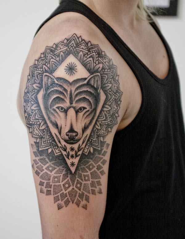 The mandala tattoo is looking so beautiful, the geometric wolf on the mandala tattoo