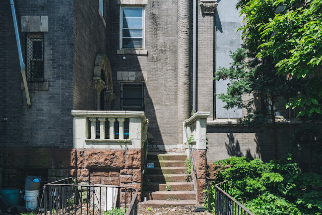 intricate church rectory entrance with numbered cornerstone