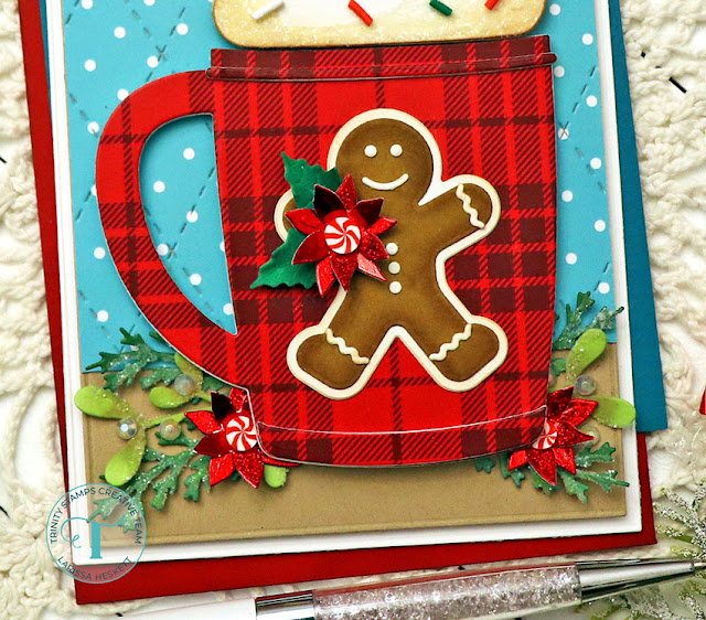 Gingerbread Mug Card by Larissa Heskett for Trinity Stamps for the Coffee Lovers Fall/Winter Blog Hop 2022 using Santa Mug Die Set, Poinsettia Bitty Botanicals Die Set, A7 Modern Embossed Die Set, Argyle Stitch Background Die, Handmade Holiday Embellishment Mix, Holiday Trimmings Patterned Paper, Milk Glass Rhinestones