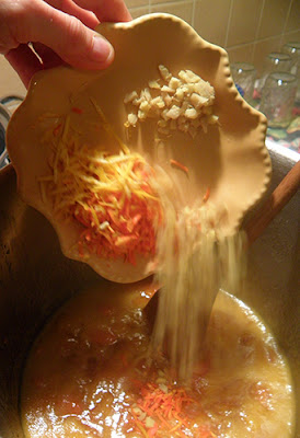 Art Shot of Citrus Peels and Ginger Being Dumped into Pot