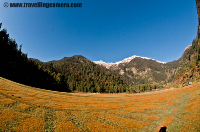 Full Day Break on fourth day of MTB Himachal 2010 - Kullu Sarahan : Posted by VJ SHARMA on www.travellingcamera.com : Its been more than two weeks that we are sharing a long journey of MTB Himachal 2010... Here comes the fourth day which was rest day for all the riders... I must say that Kullu Sarahan was the best choice to spend one complete day... Check out these photographs to know how the day was spent in a valley surrounded by snow capped mountains.Here is a view of our camp in the playground of government school at Kullu Sarahan... In the morning everyone of us was amazed by seeing the beauty around this place. During last night, no one was able to guess all this except the mountains with shining snow on the top. An early morning view with full moon sitting on top of snow covered hills.... These hills were just behind our tents and it was wonderful...Snow covered hills were not the only beauty of this place... There was a huge ground in the bottom of these hills and it was huggge... Khajjiar in Chamba region of himachal was coming in my mind while I saw it... What a wonderful schooling experience... Class in open area while taking sunbath in the huge ground in the bottom of snow capped mountains of Shrikhand ranges... Here some of the children having their class in Sarahan valley...Who wanted to miss this opportunity.. One of the MTB rider inspired by the school children and started cleaning his bike in the ground behind the school... I don't think I can explain this experience in words..Buggy standing in front of the mountains with partial sunlight... Its an early morning scene when rising sun was not visible but its effect made us realize that the process has started... This was the only day I saw some enthu among folks in the camp... Some of them were singing, few of them dancing and many of them were screaming... but full on masti !!!