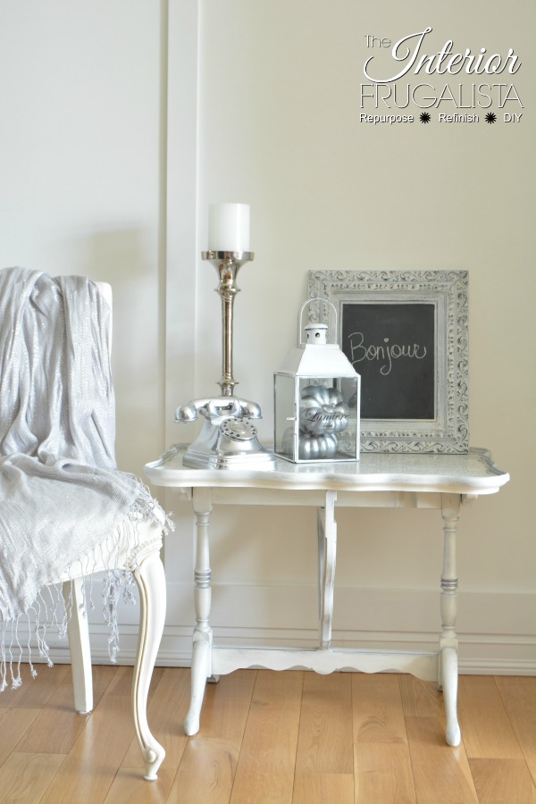 A gorgeous antique tilt-top table makeover with decoupage metallic wallpaper top.