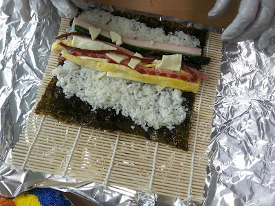 Kimbap with the seaweed on the bottom.