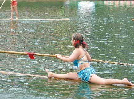 Crossing the river with a bamboo China