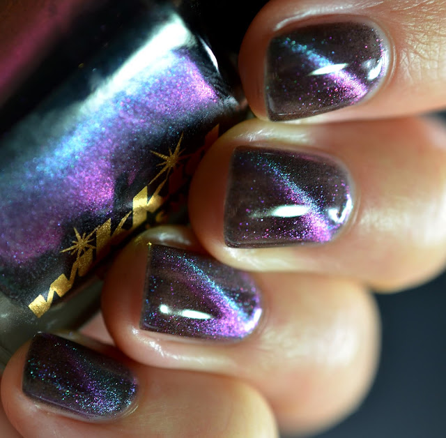 magnetic nail polish shifting from green and blue to purple