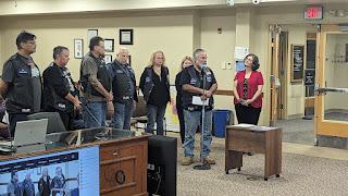 Elks riders presenting the check for $1000