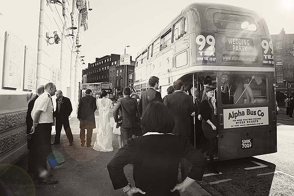 people getting off routemaster wedding bus