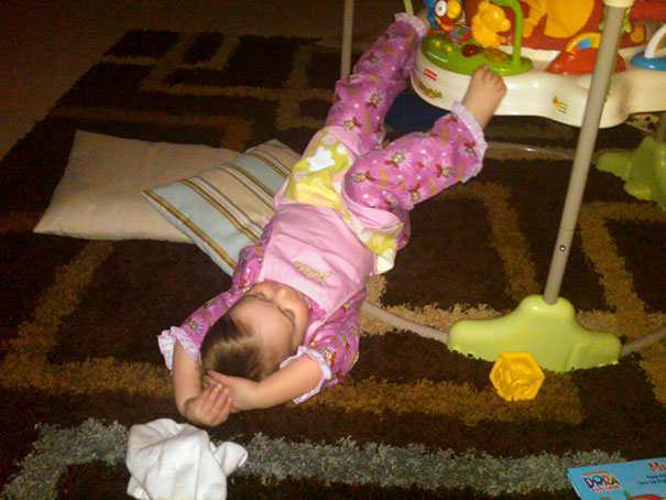 15+ Hilarious Pics That Prove Kids Can Sleep Anywhere - Napping Next To A Baby's Chair