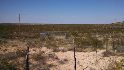 A photo of the three graves located on the Slash Ranch in Texas.