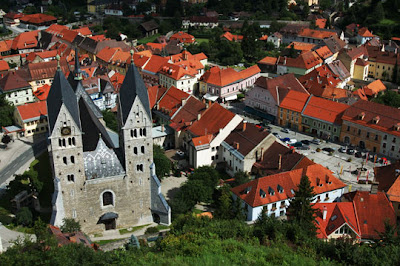 Carinthia, Austria - Gothic Stadtpfarrkirche St. BartholomSus (12th and 14th century) and Hauptplatz (right) from Petersberg, Carinthia