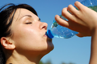 Woman Drinking Water inwards the Morning