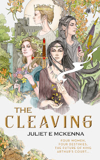 Cover for book "The Cleaving" by Juliet McKenna. Four women, in flowing dresses, one with a crown, one cradling vapour in her hands set in a slightly William Morris landscape of flowers and trees with a castle in the background.