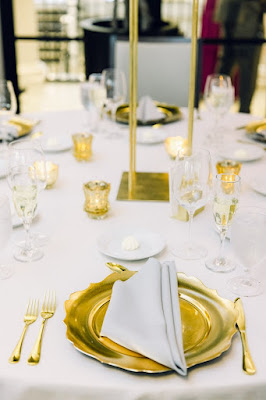 gold scalloped chargers and gold flatware