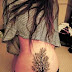 Black Color Tattoo On Women Lower Back Hip