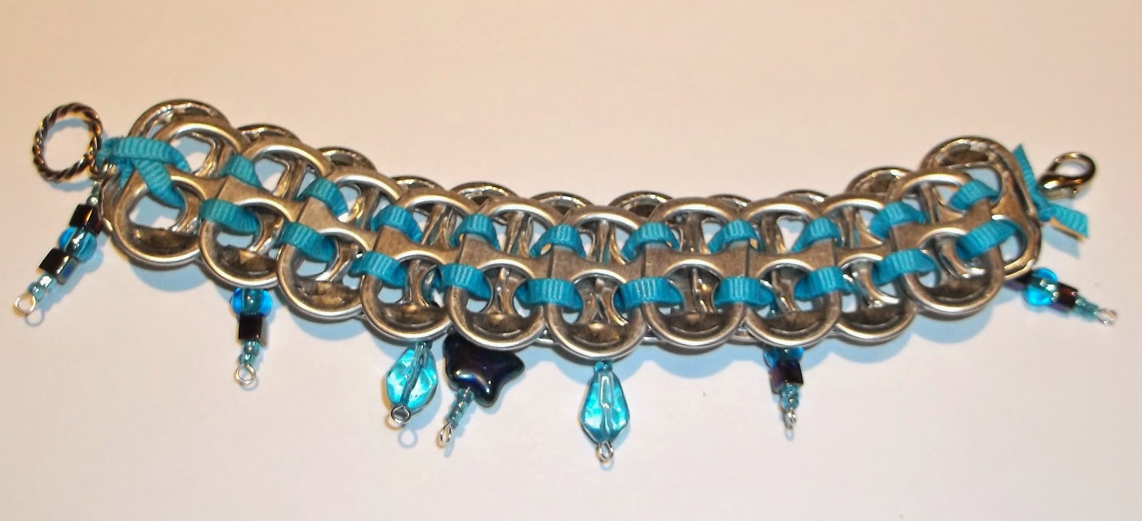 https://www.etsy.com/listing/191651101/upcycled-pop-top-bracelet-with-blue