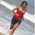 Priyamani Hot Red Bikini Running in Beach Hd Image Gallery