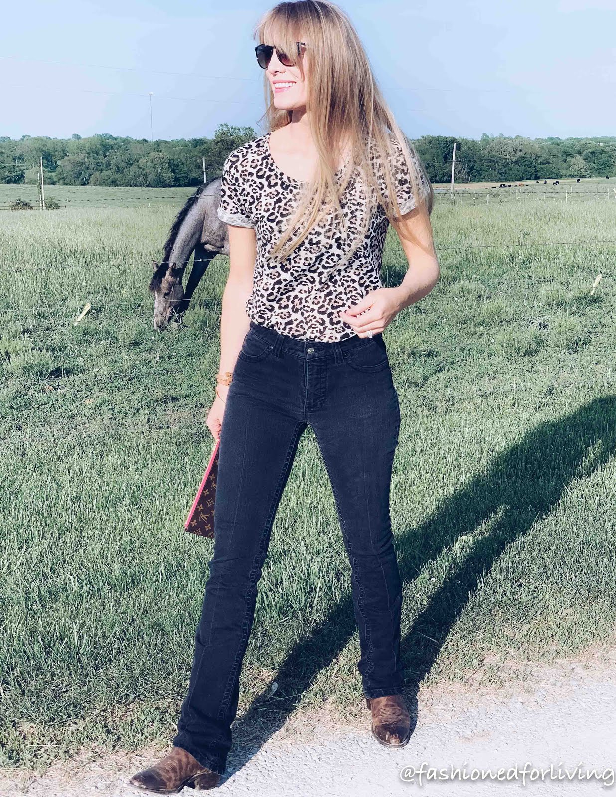 kimes betty jeans outfit with leopard tee. cowgirl boots.