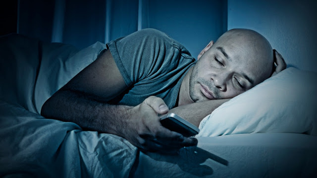 7. Using your phone, tablet or computer in bed.