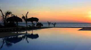 Sun setting over Palagama Beach Resort Infinity pool