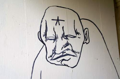 Graffiti image of a street-wise anarchist/thug in Geneva, Switzerland