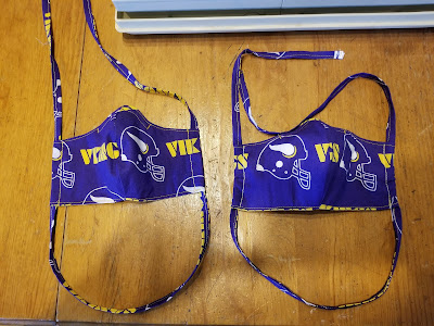 Purple face masks made from Viking's fabric