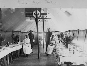 Nursing Sister WW1 Photo Album: 28V Sisters in Mess Tent check flowers