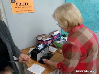 Miss Connie prints up photos for thru-hikers